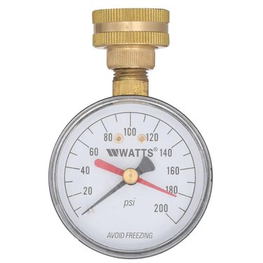A gold and white water pressure gauge