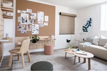 large office with desk, couch and cork board with Home Office Storage Ideas