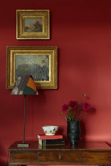 Room painted with Incarnadine, a crimson red by Farrow and Ball