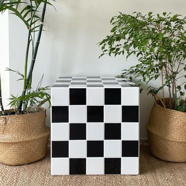 Black and white checkered tiled end table