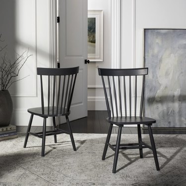 black farmhouse-style spindle-back chairs