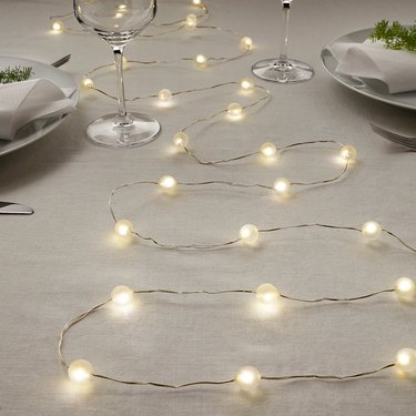 table with LED string lights