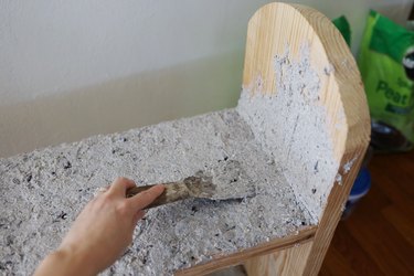 Applying hypertfa mixture to bench with a putty knife