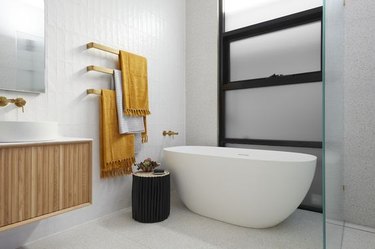 Bathroom with three towel bars.