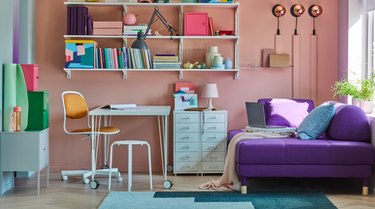 work space with white desk and purple couch