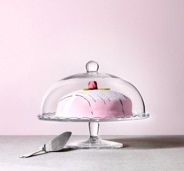 clear cake stand with pink cake
