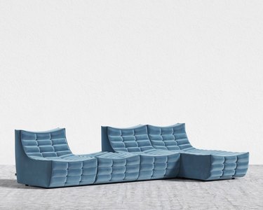 blue modular sectional in the style of a togo sofa