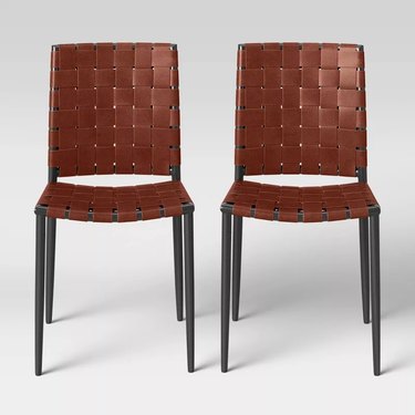 two woven leather dining chairs