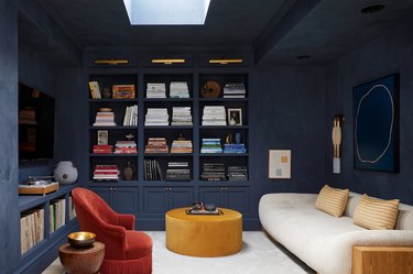 inky blue living room with earth tones