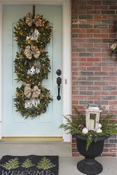 winter front porch with three wreaths