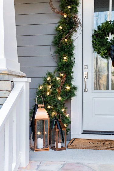 winter front porch with copper lanterns