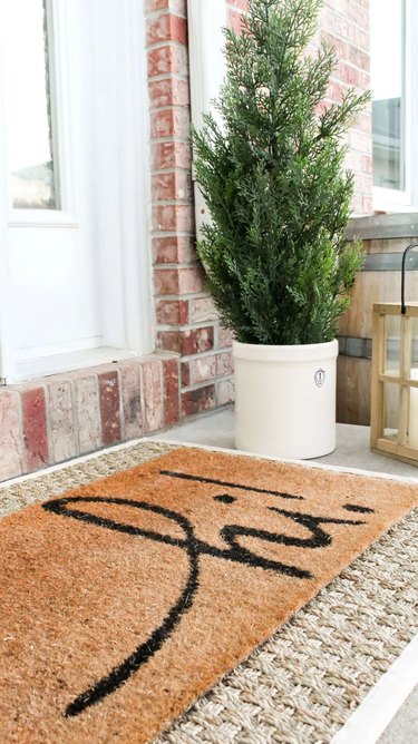 winter front porch with layered doormats
