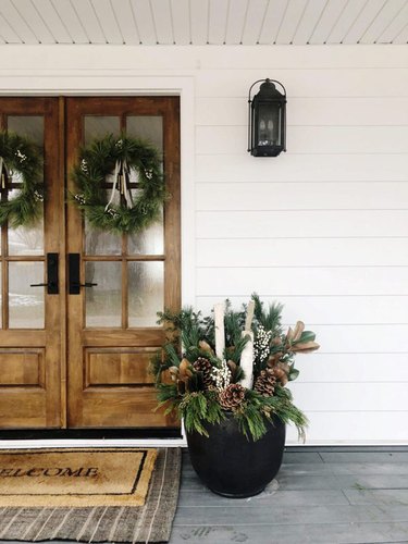 winter front porch with potted greens