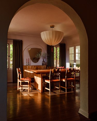 dining room with vintage pendant light and wood furniture