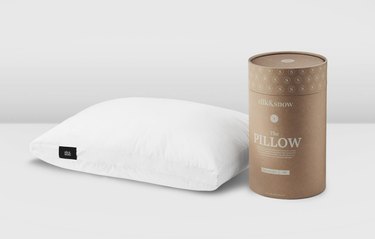silk and snow pillow next to a cardboard packet