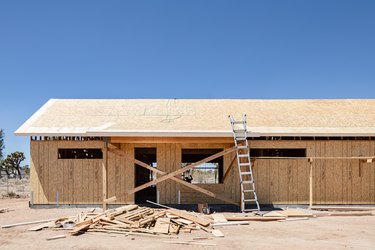 House construction with wood beams and sheathing in the desert