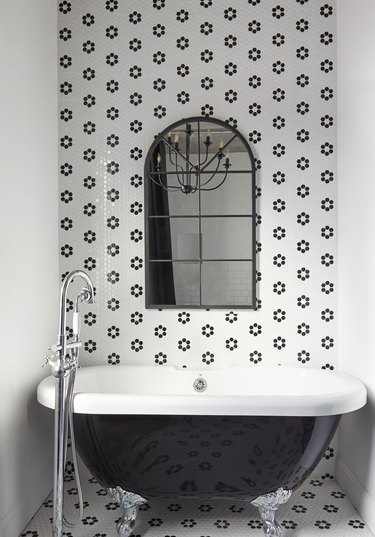 black and white flower tile wall in bathroom