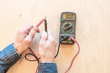 testing multimeter electrical tester on wood background
