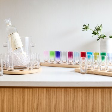 colorful shot glasses on paddle