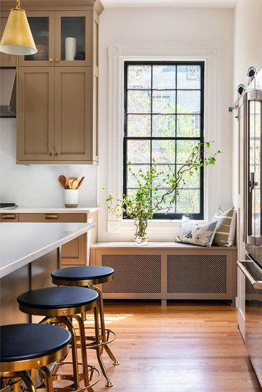 airy and elegant kitchen with bench-covered radiator