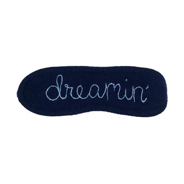Navy eye mask for sleeping with the word "dreamin'"
