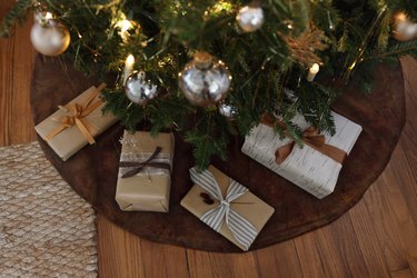DIY brown velvet tree skirt under tree with presents