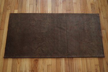 Large piece of brown velvet fabric folded in half