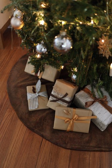 DIY brown velvet tree skirt around tree with presents