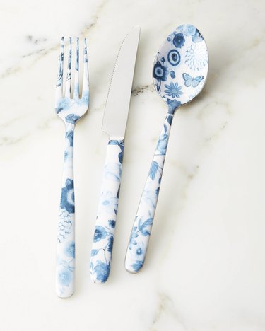 blue and white flatware with floral and butterfly details