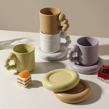 mugs and coasters in various colors
