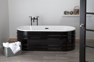 A black galvanized stock tank bathtub