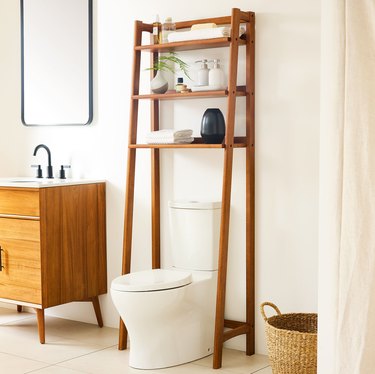 sleek, midcentury modern wood frame over the toilet
