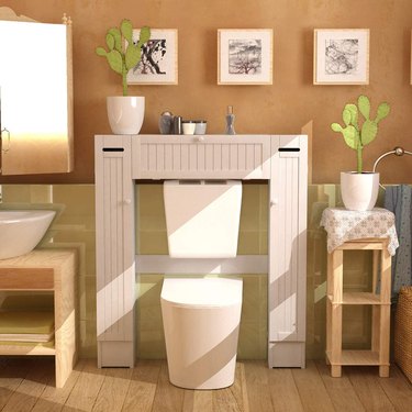 low over-the-toilet white bathroom cabinet