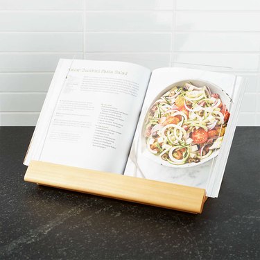 cookbook in a book stand with open pages