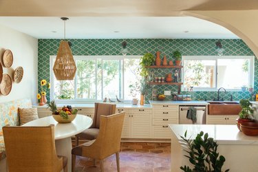 Kitchen are with green tile. backsplash