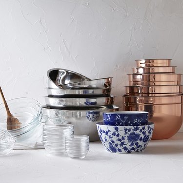 variety of mixing bowls in different piles