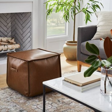 cube leather pouf in sitting room