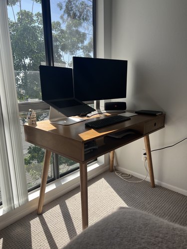 midcentury modern desk with computer on it