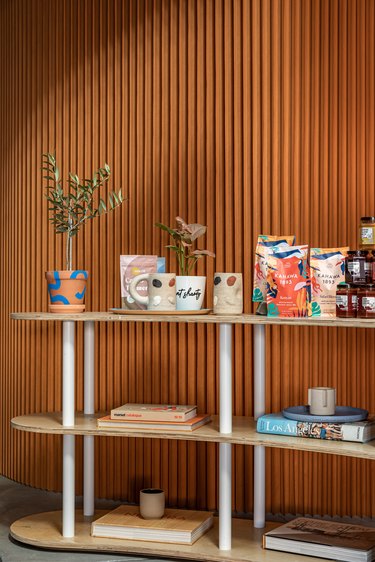 Black Spaces iteration of Hunker House showroom featuring products on shelving