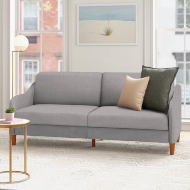 small gray sleeper sofa in living room