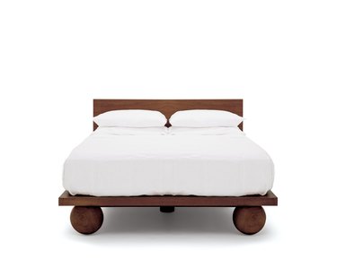 wood platform bed with ball-shaped feet