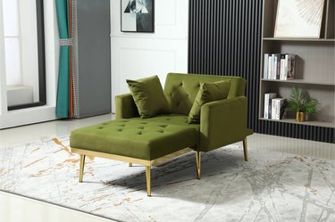 green chaise lounge with gold legs in living room