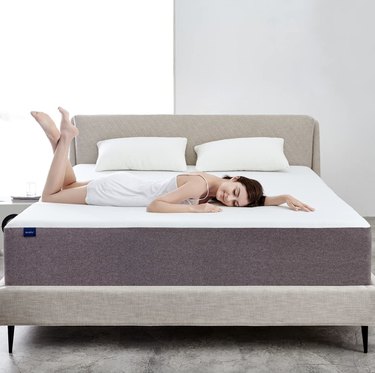 Molblly memory foam mattress in a bedroom with a woman laying on top