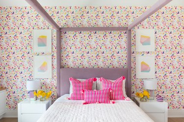 girl's bedroom with lavender poster bed and fuchsia accents