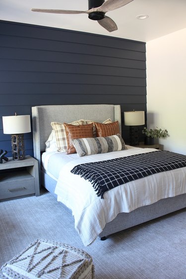 blue bedroom with gray headboard