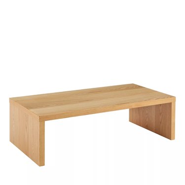 light-wood sled coffee table