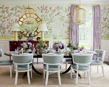 dining room with purple drapery and mint green chairs