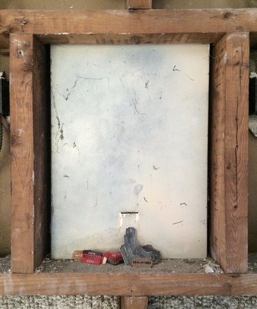 medicine cabinet slit with razor blades inside the wall