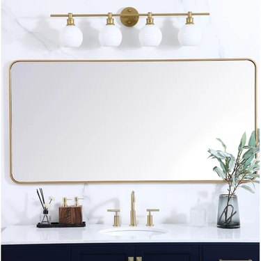 rounded rectangle mirror over bathroom sink