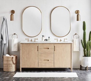bathroom double vanity with two pill-shaped mirrors